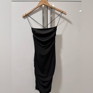 Short black silky dress with micro thin straps